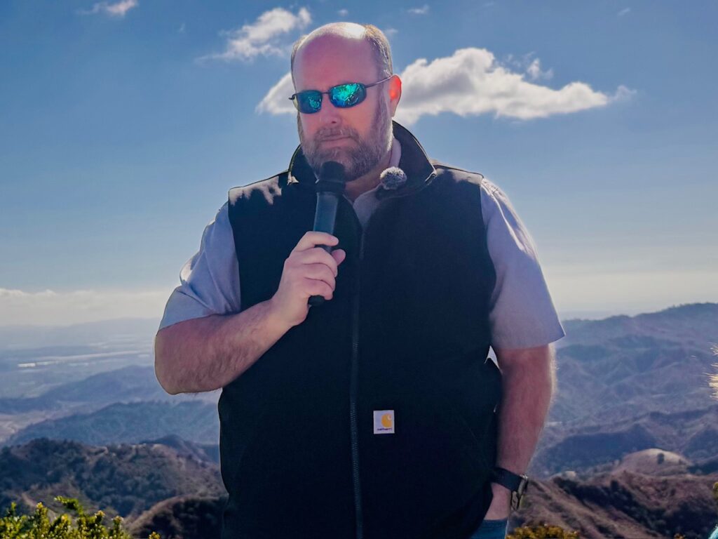 Erich Bradley speaking to journalists at Ojai Mountain Estate property